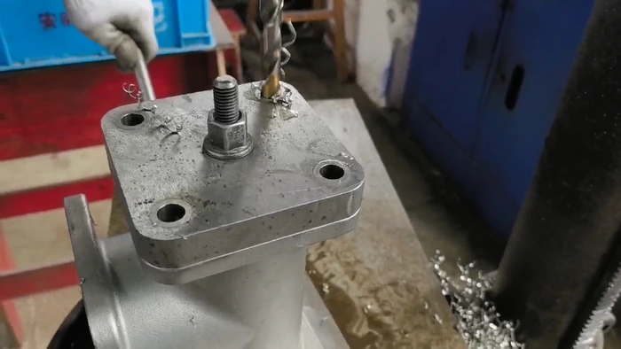 Log 12 :3,000 Precision Cast and Machined Valve Bodies Shipped to the USA(pic2) valve body held in a machining fixture for hole and flange processing