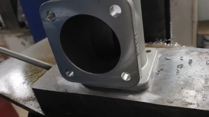 Log 12 :3,000 Precision Cast and Machined Valve Bodies Shipped to the USA(pic4) close-up of a machined valve body flange surface
