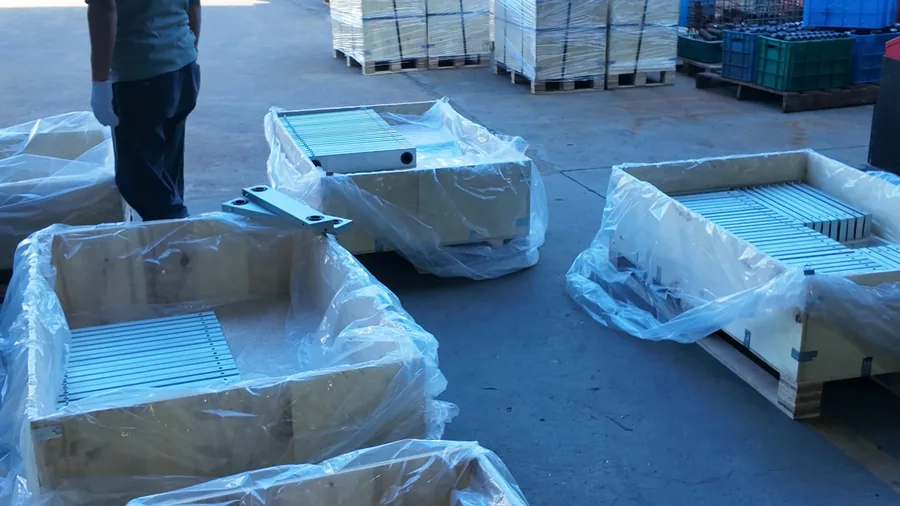 Log 15: 350 Aluminum Forged Support Brackets Packed for Germany(Image4) Several open wooden crates showing organized aluminum support brackets
