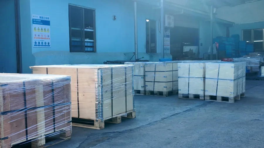 Log 15: 350 Aluminum Forged Support Brackets Packed for Germany(Image6) Multiple strapped wooden crates staged outside the production facility