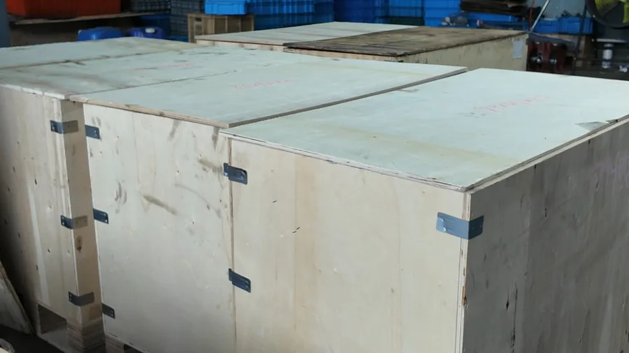 Closed wooden crates prepared for handling after packing support frames
