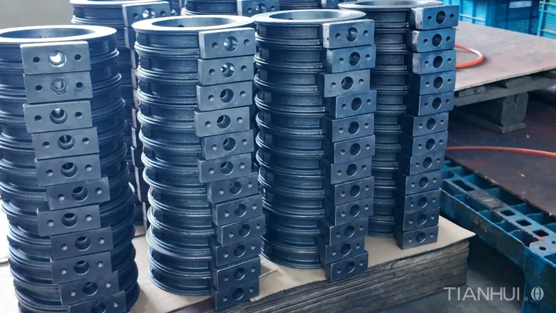 Log 16: 1,000 6-Inch Stepped Butterfly Valve Bodies for Brazil(Image3) Stacks of stepped butterfly valve bodies with repeated drilled mounting pads